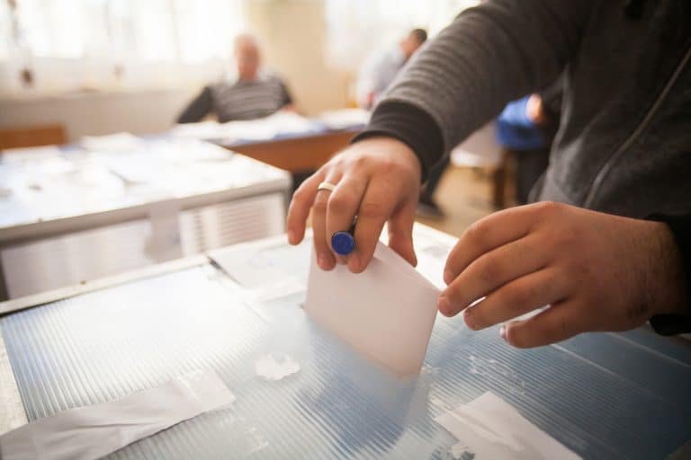 Person voting at polling station